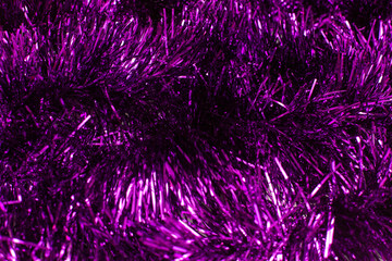 Purple shiny tinsel close up