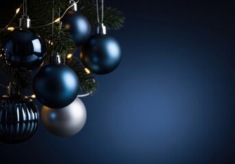 Elegant christmas tree branch blue silver baubles festive string lights on a dark blue background