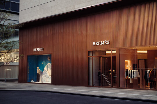 Shenzhen, China - December 2, 2025 : Herm&egrave;s luxury fashion boutique with elegant signage and modern storefront in upscale shopping district. Designer brand store, high-end retail