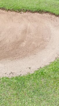 Golf Sand Bunker Shot &mdash; Ball Landing in Sand Motion | Portrait Action Golf Field Close-Up