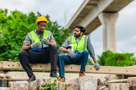 Tired Railway Workers Encouraging Each Other