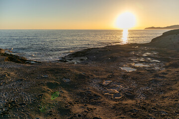 Sunset on Cane Malu beach in Sardinia.