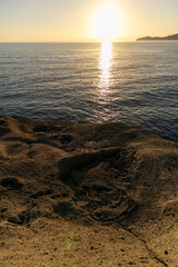 Sunset on Cane Malu beach in Sardinia.