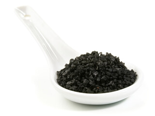 Food and Health - Black Stone Salt on white Background