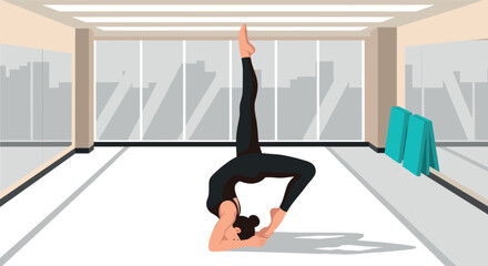 Modern yoga studio with woman practicing advanced pose in bright room
