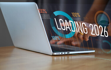 Businessman Pointing at Loading 2026 &mdash; Future Data and Information Update Concept