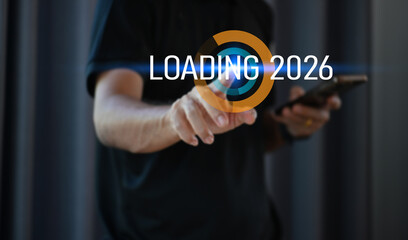 Businessman Pointing at Loading 2026 &mdash; Future Data and Information Update Concept