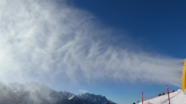Passo del Tonale, Italy. Snow cannon. Snowmaker in action at ski resort spraying artificial snow. Winter contest. Alps