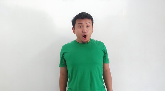 Wow, Funny face of Asian man. Shocked asian man isolate on white. Amazed and feels shocked asian man. Indonesian man with suprise expression. looking on the camera with shocked gesture.
