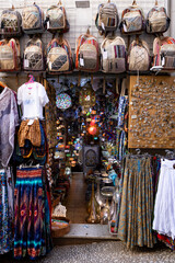 Vibrant Moroccan Market Stall with Handmade Bags and Colorful Lamps.