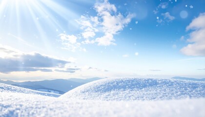 Obraz premium Peaceful winter scene featuring snow-covered hills under a bright blue sky with sunlight and clouds.