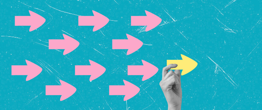 Art collage, Hand pointing at yellow arrow among pink arrows on blue background in a digital design