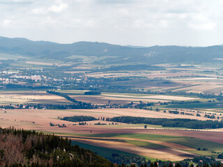 Rural Landscape with fields and hills in The Czech Republic. City Broumov in in the distance on the left