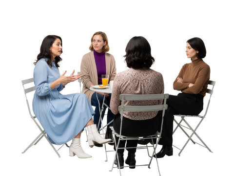 Four Women in Conversation &ndash; A Moment of Connection and Camaraderie at a Round Table

