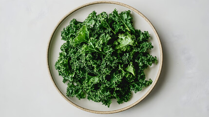 Fresh green kale leaves on white plate