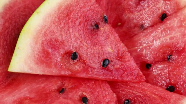 Bright red watermelon slices circle rotation close up