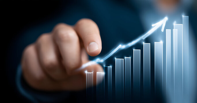 A close-up of a hand pointing at an upward bar graph, symbolizing growth and success in business and finance.