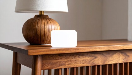 Wooden table with lamp and blank display mockup.