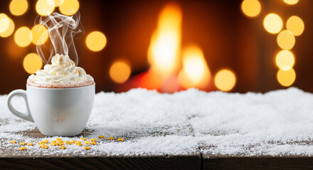 A white mug with whipped cream and steam on a snowy surface with blurred lights, representing winter, holiday season, warm atmosphere and celebration