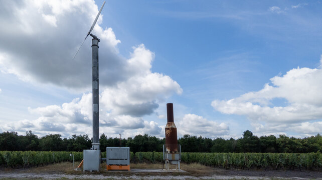 frost fan wind machine frost protection tower for crops in bordeaux french vineyard - Powered by Adobe