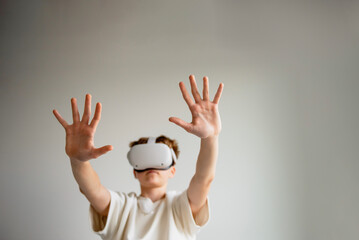teenager playing with virtual reality glasses