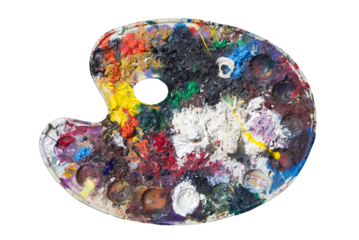 Paint pallet , isolated, old art materials , with oil paint ,  well used with remnants of lots of oil paints almost looking like a sculpted landscape that is seen from above.  
