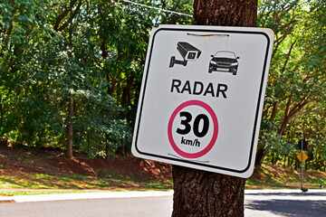 Sign indicating a speed limit of 30km and a speed camera, Ribeirao Preto, Brazil