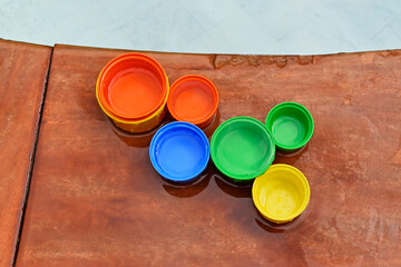 Children's plastic cups on the edge of the pool, Ribeirao Preto, Brazil