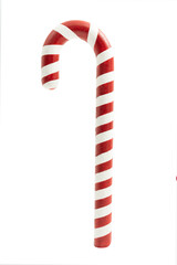 Candy cane decoration stood upright with red and white stripes against a plain background during the holiday season