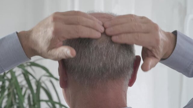 Rear view older man with bald patches on scalp, showing signs alopecia and age-related hair thinning, Anti-aging treatments for balding men, hair loss