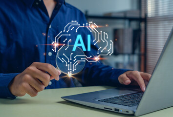 AI technology concept with hand holding magnifying glass over glowing digital brain icon while using laptop, highlighting artificial intelligence, data analysis, innovation, modern digital solutions.