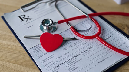 Stethoscope pen and heart symbol on medical prescription form at a clinic