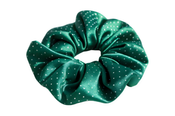 Shiny emerald green scrunchie with small white dots isolated on transparent background