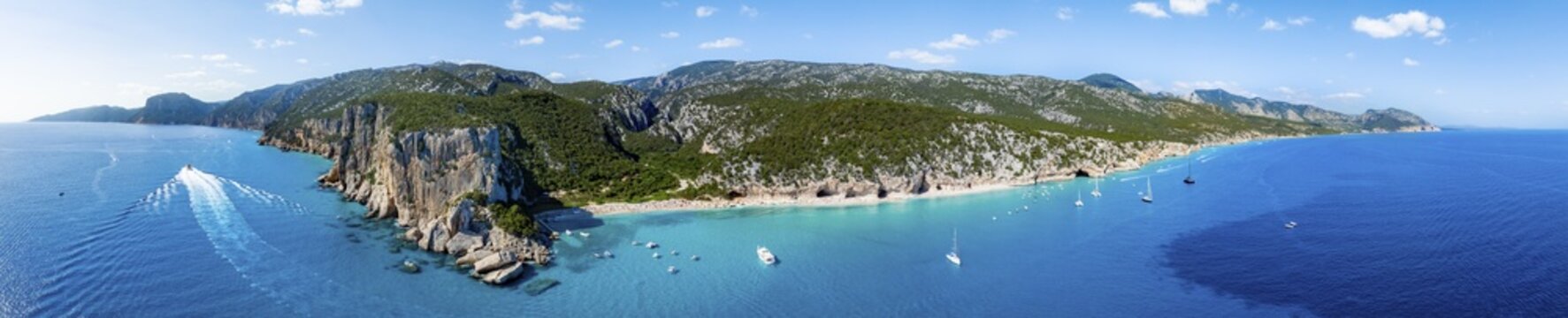 Picturesque rocky coast, cliffs and Cala Luna beach, aerial view, Golfo di Orosei, Baunei, Sardinia, Italy