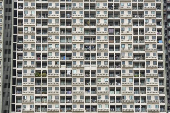 Exterior fa&ccedil;ade of a residential high-rise building of Condo U (a brand or series name of the Thai real estate developer Grand Unity Development Co., Ltd. (often abbreviated Grand U), Bangkok Yai district, the old town of Bangkok, Thailand
