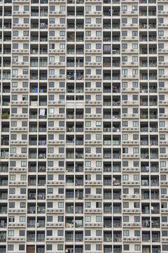 Exterior fa&ccedil;ade of a residential high-rise building of Condo U (a brand or series name of the Thai real estate developer Grand Unity Development Co., Ltd. (often abbreviated Grand U), Bangkok Yai district, the old town of Bangkok, Thailand
