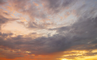 Clouds and sky at sunrise and sunset,Clouds and sky at sunrise and sunset,Sunset sky clouds in the evening with Orange gold sunlight in golden hour, Panoramic Horizon sky background  