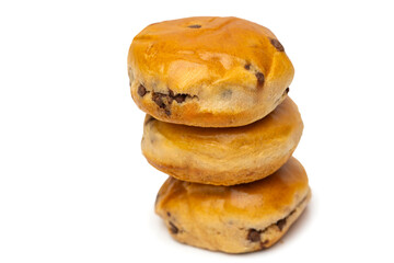 Bun with chocolate chips isolated