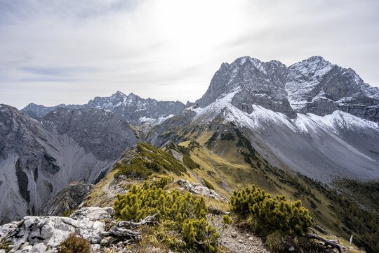 Hiking trail on the ridge of the Hahnkampl, mountain panorama with steep rocky peaks, view of Lamsenspitze peak, in autumn, Karwendel Mountains, Alpenpark Karwendel, Tyrol, Austria