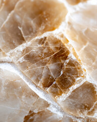 Obraz premium This close-up image showcases the intricate details and textures of a stunning natural stone, highlighting its unique patterns and warm colors that attract the eye.