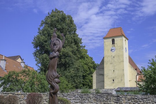 Church and wooden sculpture in the fortified village of Žumberk u Nov&yacute;ch Hradů, South Bohemia, Czech Republic