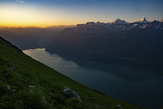 Mountain ridge with Swiss mountains and Lake Thun in the background at sunrise, Interlaken, Bernese Oberland, Switzerland
