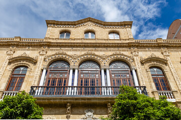 Obraz premium Jerez de la Frontera, Spain - May 15, 2025: Details of the medieval houses and palaces in the historic center, decorated for Holy Week, in Jerez de la Frontera, Spain