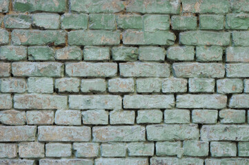 Old green brick wall texture. Abstract background and texture for design.