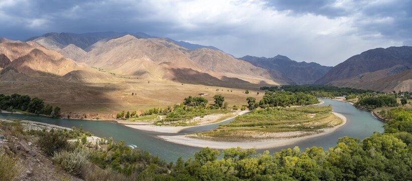 Green river valley with Naryn river between mountains, mountain landscape near Kazarman, Naryn region, Kyrgyzstan