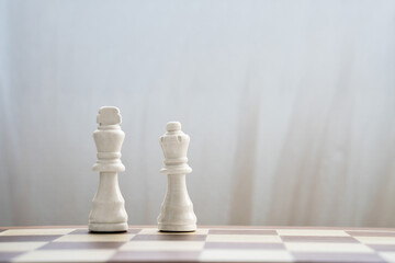 white king and queen on chess board color of the year 2026 cloud white dancer