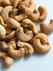 Roasted Cashew Nuts Close-Up on White Background