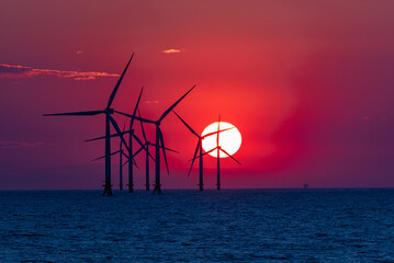 Wind turbines at sunset