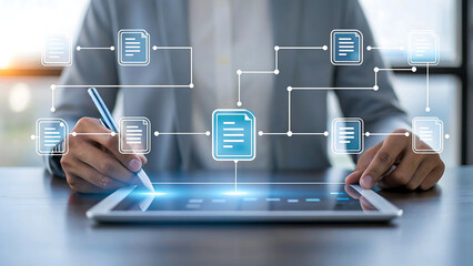 Businessman interacting with a digital tablet displaying connected document icons and flowcharts