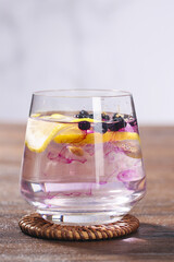 Traditional Chinese Wolfberry Goji Berry Tea with Lemon in Glass Cup - Healthy Herbal Beverage